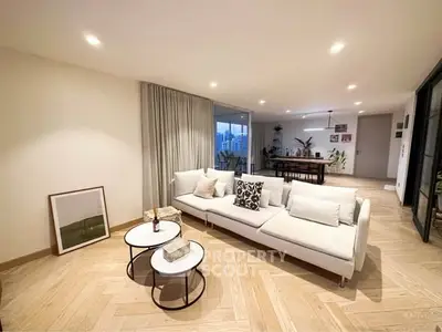 Spacious modern living room with elegant decor and open layout, perfect for entertaining.