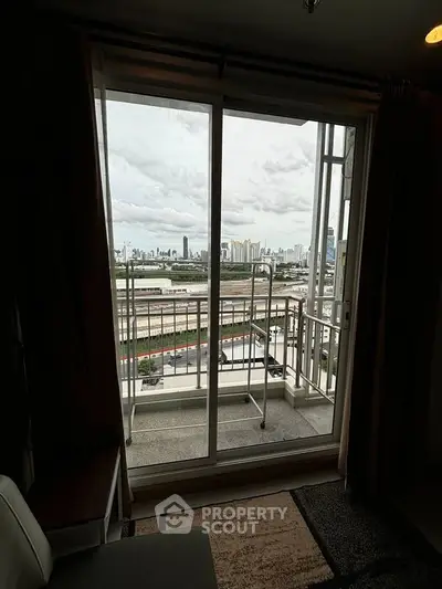 Stunning city view from a cozy apartment balcony, perfect for urban living enthusiasts.