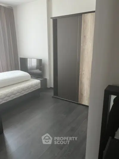 Modern bedroom with sleek wardrobe and minimalist decor