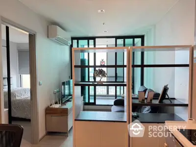 Modern open-plan living room with balcony view in high-rise apartment