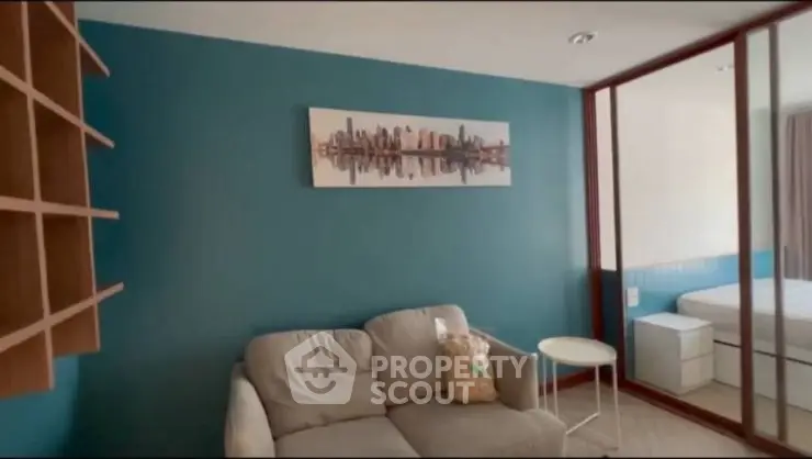 Modern living room with stylish decor and comfortable seating in a cozy apartment.