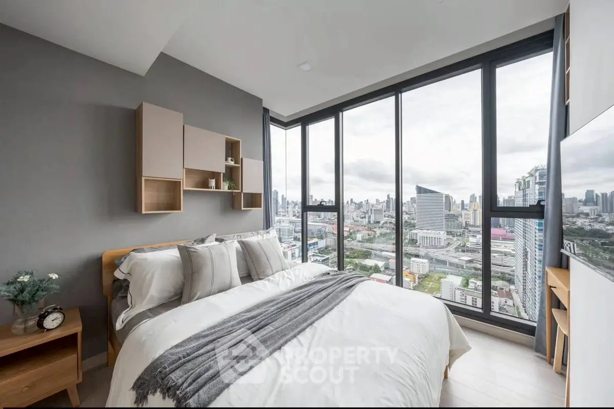 Modern bedroom with stunning city view and stylish decor