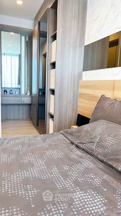 Modern bedroom with stylish decor and ample storage space