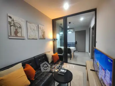 Modern living room with stylish decor and cozy seating in a contemporary apartment.