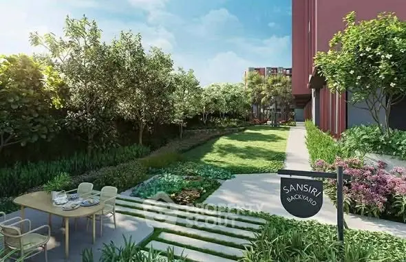 Lush garden with outdoor dining area in modern residential complex.