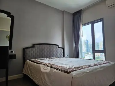 Modern bedroom with city view and elegant decor