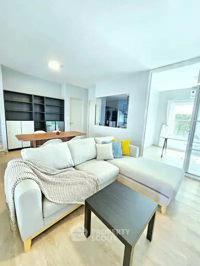 Spacious modern living room with cozy sofa and stylish decor