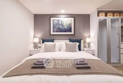 Cozy bedroom with modern decor and ample storage space