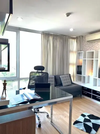 Modern study room with sleek furniture and large windows