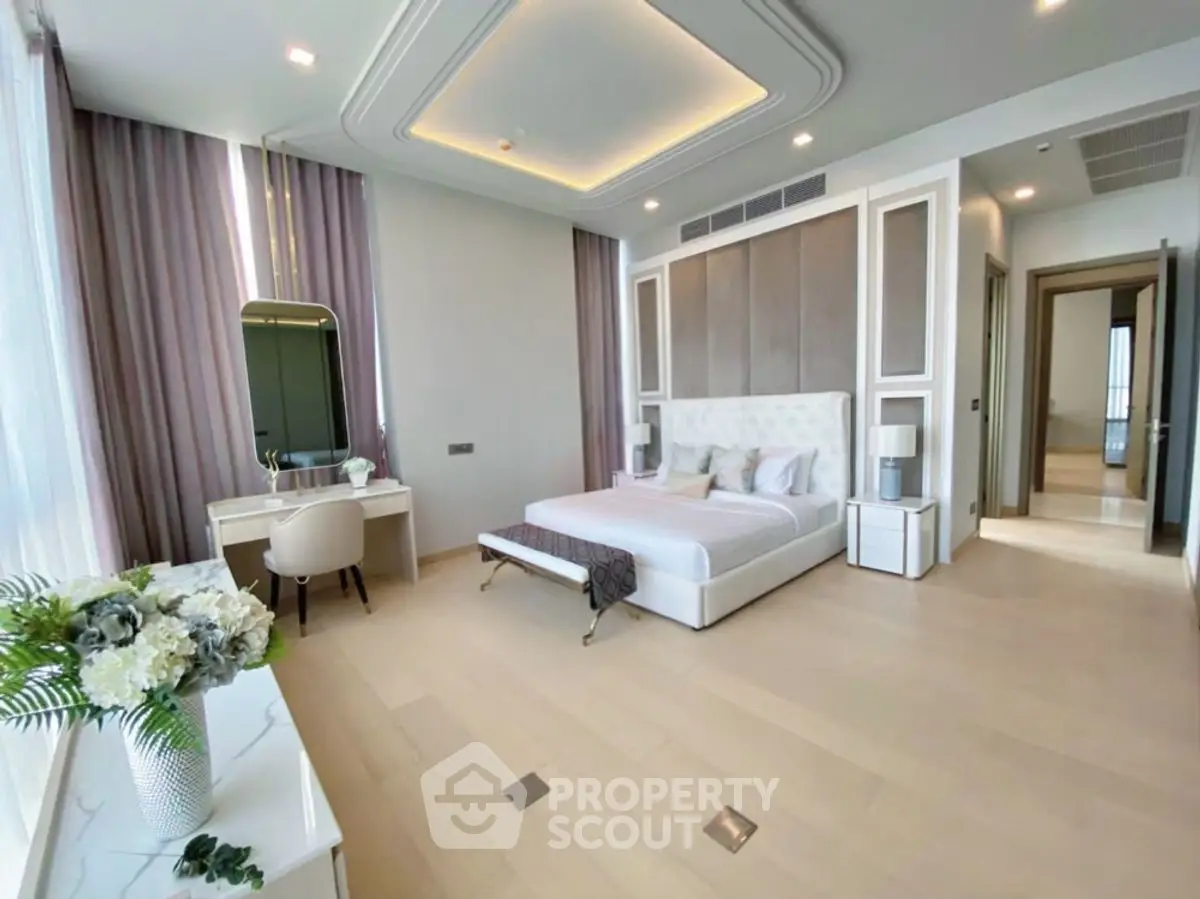 Luxurious modern bedroom with elegant decor and ample natural light