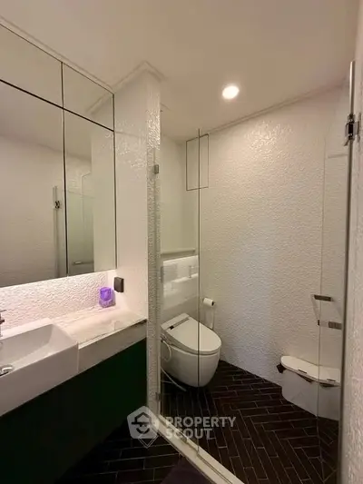 Modern bathroom with sleek design and glass shower enclosure