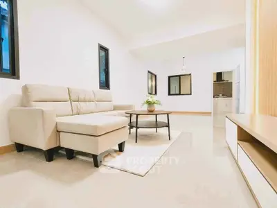 Spacious modern living room with elegant beige sofa and stylish decor