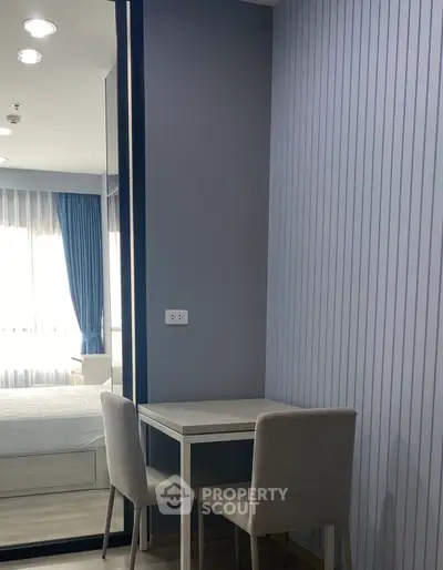 Modern minimalist bedroom with study area and stylish decor