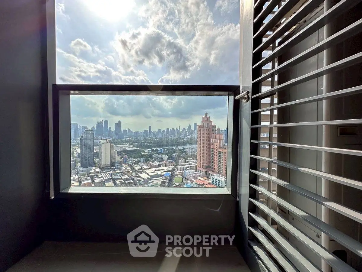 Stunning cityscape view from modern balcony with sleek railing design.