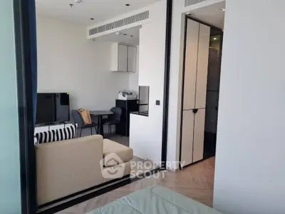 Modern studio apartment with sleek design and cozy living area, perfect for urban living.