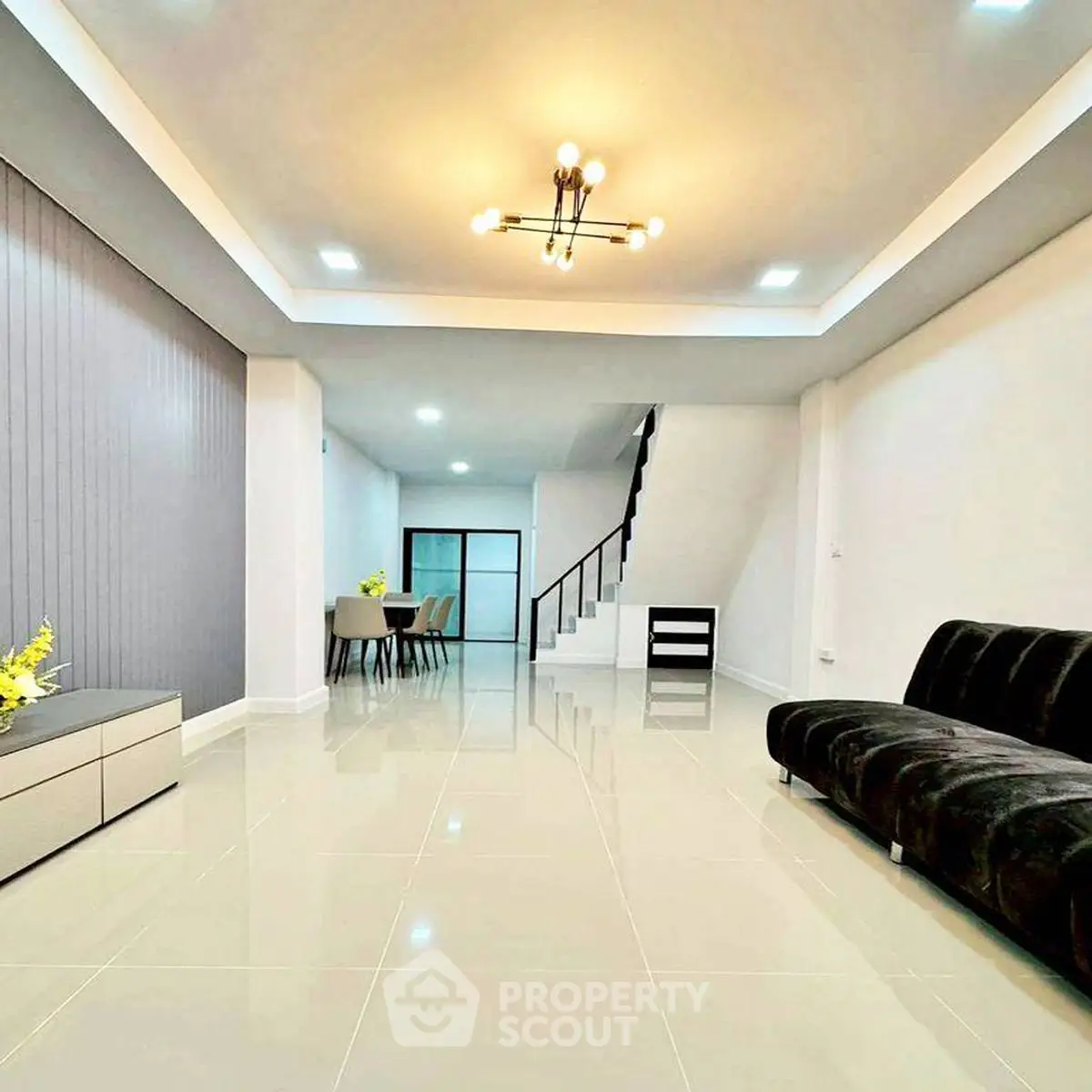 Spacious modern living room with sleek design and elegant lighting