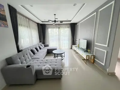 Spacious modern living room with large sectional sofa and elegant decor