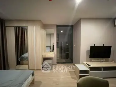 Modern bedroom with sleek design and mirrored wardrobe