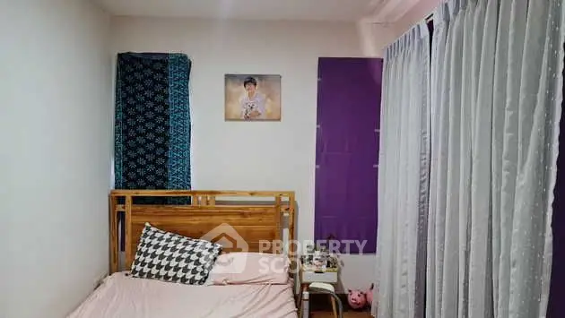 Cozy bedroom with wooden bed frame and stylish decor