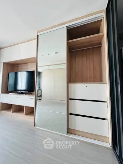 Modern living room with sleek built-in storage and entertainment unit