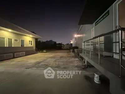 Spacious industrial property exterior with ample parking and modern facilities
