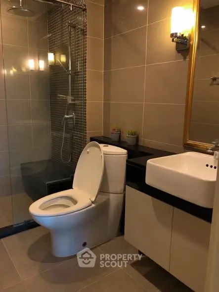 Modern bathroom with sleek fixtures and elegant lighting