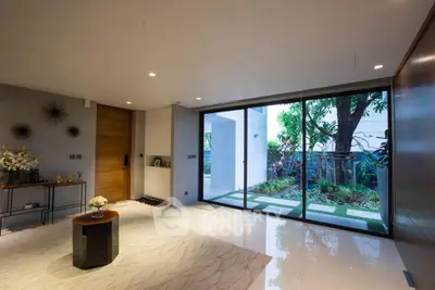 Luxurious living room with garden view and elegant decor