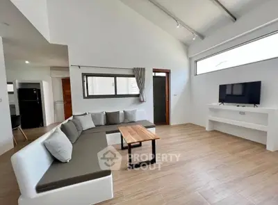 Spacious modern living room with sleek design and natural light