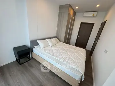 Modern bedroom with sleek design and ample storage space