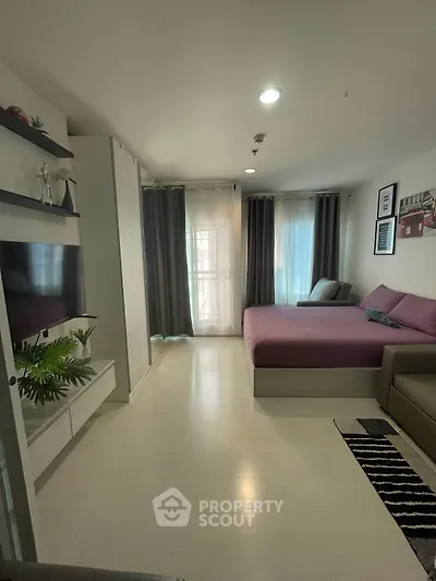 Modern studio apartment with cozy bed and stylish decor