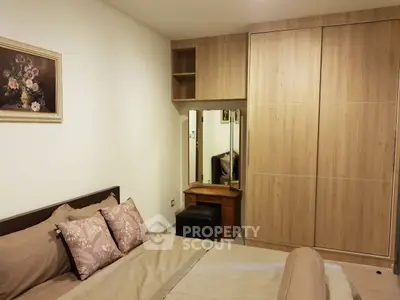 Cozy bedroom with wooden wardrobe and elegant decor