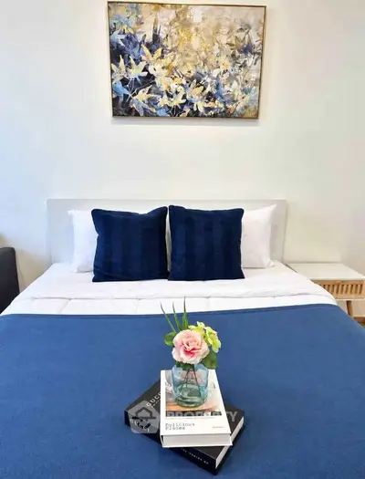 Elegant bedroom with stylish decor and cozy bedding, perfect for relaxation.
