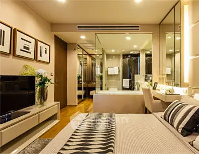 Luxurious modern bedroom with stylish decor and ensuite bathroom, perfect for urban living.