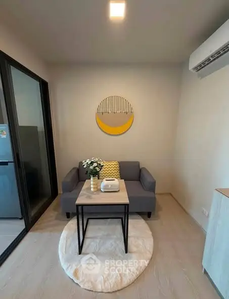 Cozy modern living room with stylish decor and air conditioning