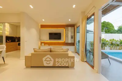 Modern living room with pool view and open layout