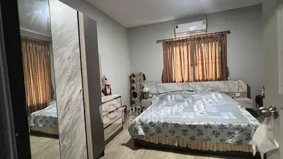 Cozy bedroom with air conditioning and stylish decor