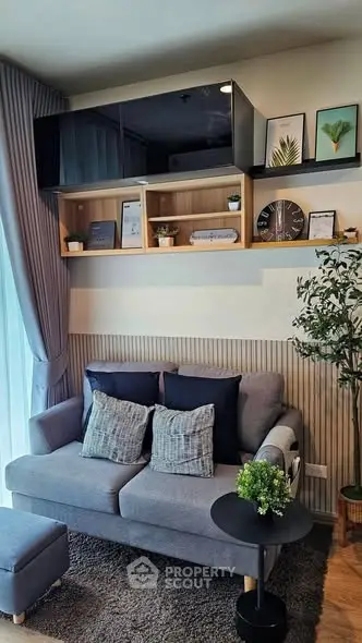 Chic modern living room with stylish decor and cozy seating in a contemporary apartment.