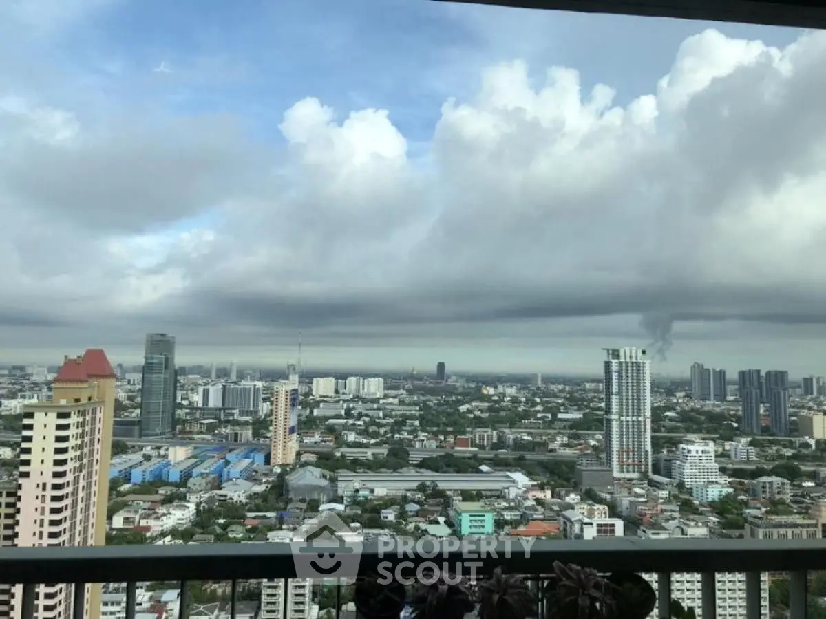 Stunning cityscape view from high-rise balcony with expansive skyline