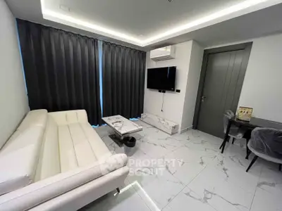 Modern living room with sleek white furniture and marble flooring