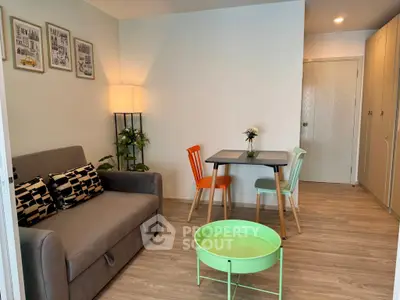 Cozy living room with modern decor and vibrant chairs, perfect for relaxation and entertaining.