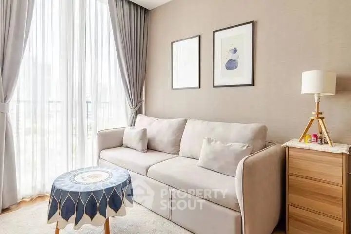 Elegant living room with cozy sofa and natural light, perfect for relaxation.