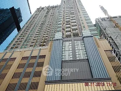 Stunning high-rise building exterior with modern architectural design and impressive vertical lines.