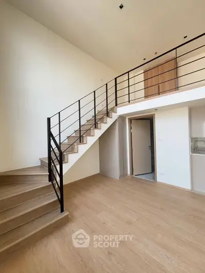 Spacious modern loft with elegant staircase and open layout