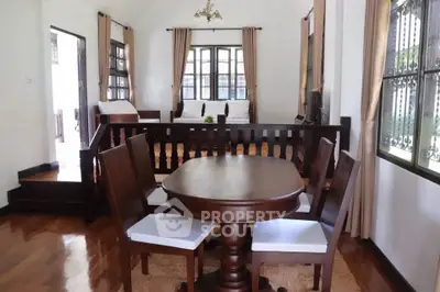 Charming living room with elegant wooden furniture and natural light