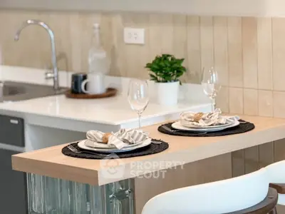Modern kitchen with elegant dining setup and stylish decor