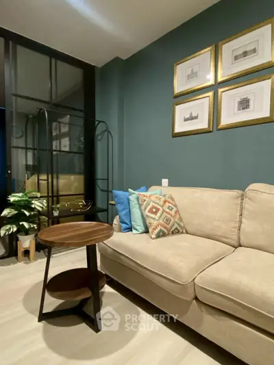 Cozy living room with stylish decor and comfortable seating in modern apartment.