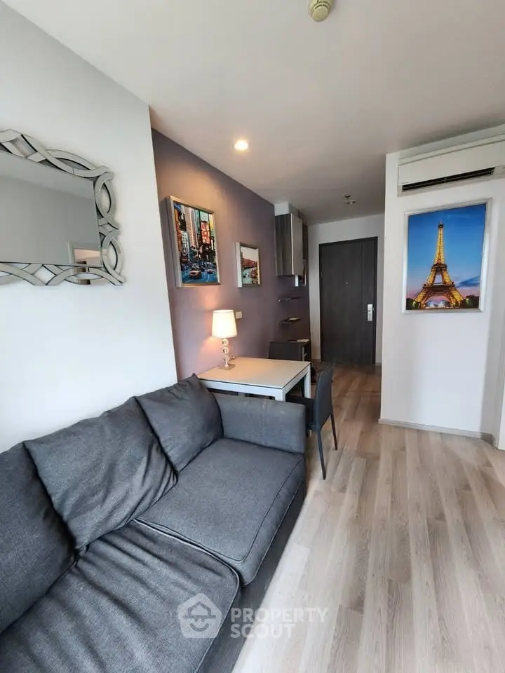 Modern living room with stylish decor and cozy gray sofa