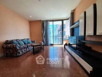 Spacious living room with modern decor and city view balcony