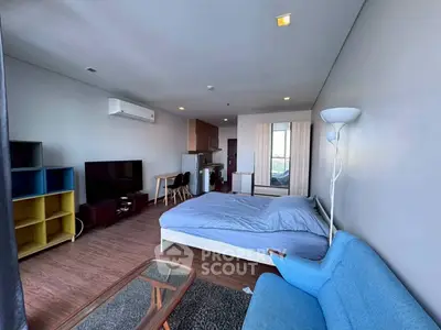 Modern studio apartment with open layout and stylish furnishings