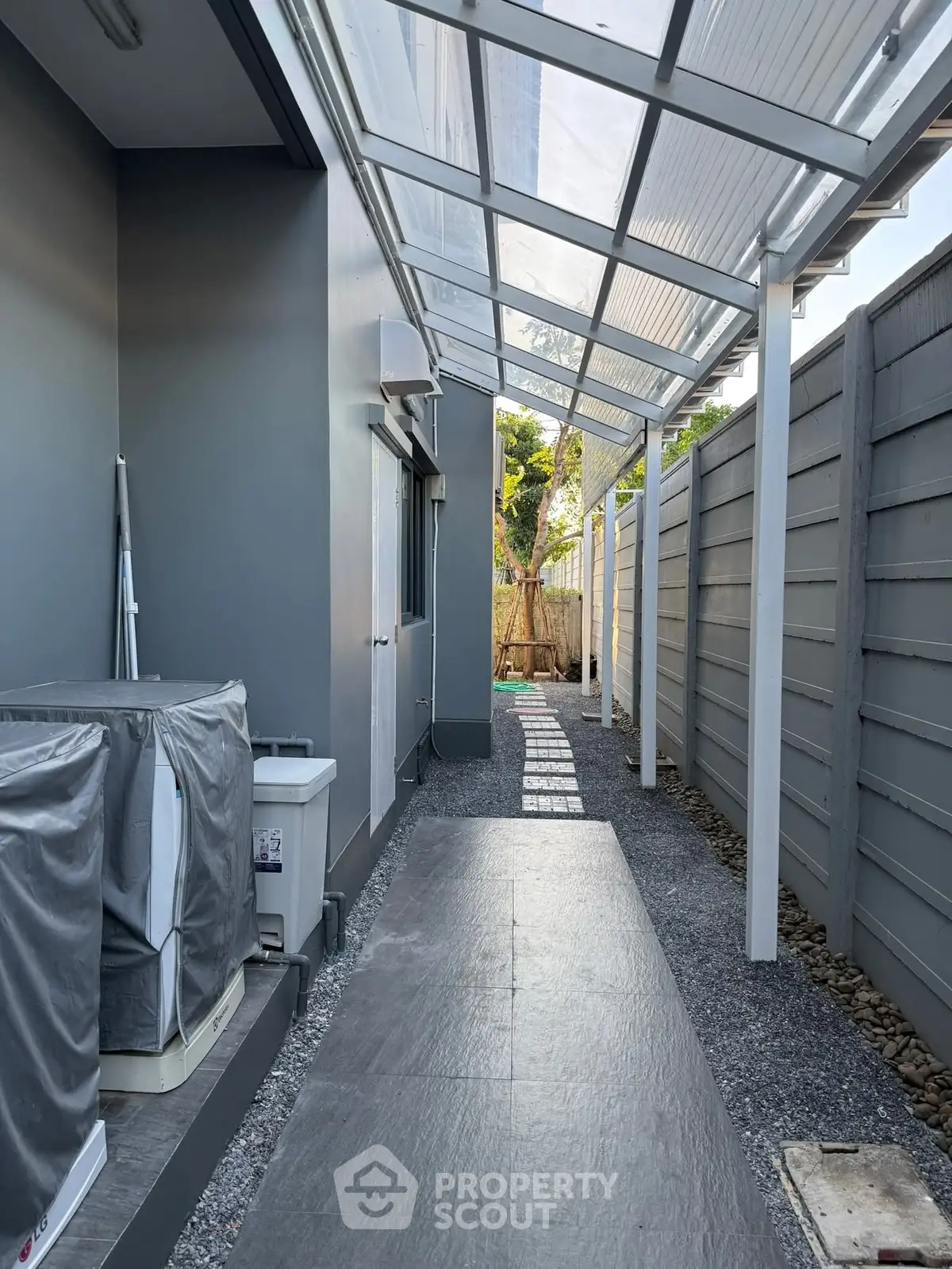Modern exterior walkway with sleek design and covered roof